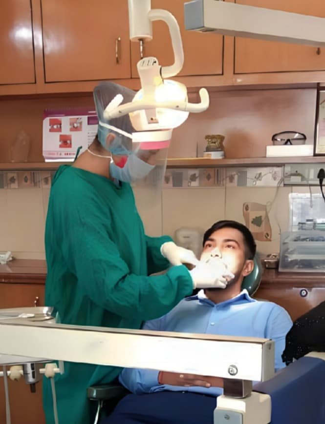 Dr. Gifty Mehta at Total Dental Care Treating a patient